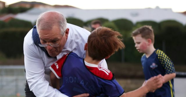 Watch: Australian Prime Minister Scott Morrison smashes a boy at a football match