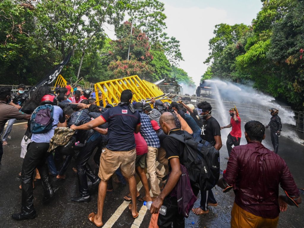 Police use water cannons to disperse university students from a protest calling for the resignation of Sri Lankan President Gotabaya Rajapaksa over the severe economic crisis near the Parliament House in Colombo, May 6, 2022.  (Photo by ISHARA S. KODIKARA / AFP) (Photo courtesy of ISHARA S. KODIKARA/AFP (Getty Images)