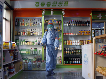 An employee of the Kyonghung Foodstuff General Store disinfects the showroom in Pyongyang, North Korea, Wednesday, Nov. 10, 2021. Before acknowledging domestic COVID-19 cases, Thursday, May 12, 2022, North Korea spent 2 1/2 years rejecting outside offers of vaccines and steadfastly claiming that its superior socialist system was protecting its …
