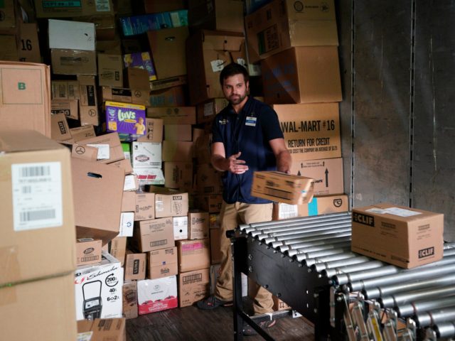 ROGERS, AR - MAY 31: A Walmart associate unloads a truck at a Walmart Supercenter during the annual shareholders meeting event on May 31, 2018 in Rogers, Arkansas. The shareholders week brings together thousands of shareholders and associates from around the world to meet at the company's global headquarters. (Photo …