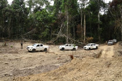 Officials from Para State, northern Brazil, inspect a deforested area in the Amazon rain f