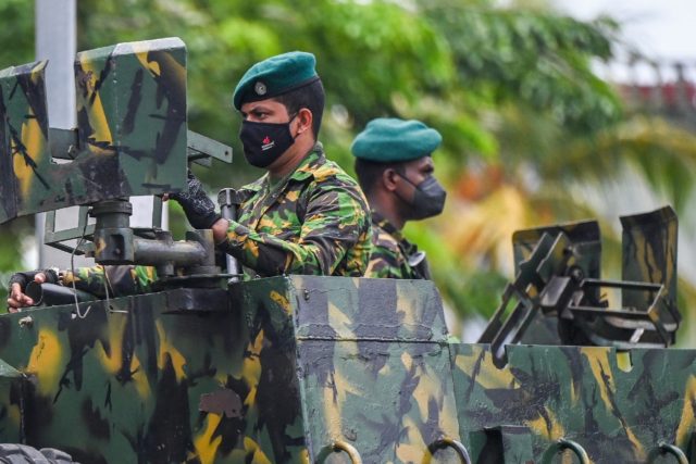 Sri Lankan troops are patrolling the streets nationwide with instructions to shoot on sigh