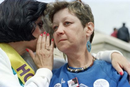 Norma McCorvey (R), known as "Jane Roe" in the landmark 1973 Supreme Court ruling legalizing abortion, is comforted by her attorney, Gloria Allred, during an abortion rights march and demonstration in Washington on April 9, 1989