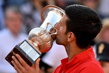 Novak Djokovic kisses the trophy after winning his sixth Italian Open