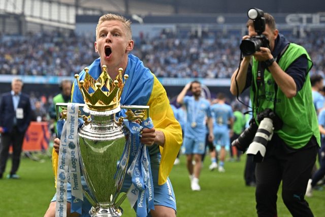 Manchester City's Oleksandr Zinchenko celebrates with the Premier league trophy