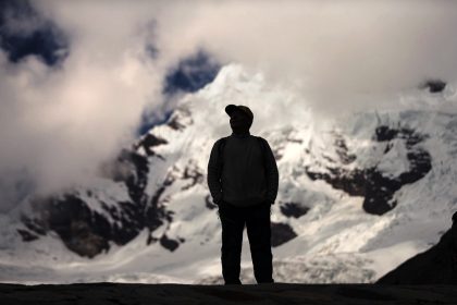 Peruvian farmer Saul Luciano Lliuya looks at the Palcaraju mountain where his Huaraz home