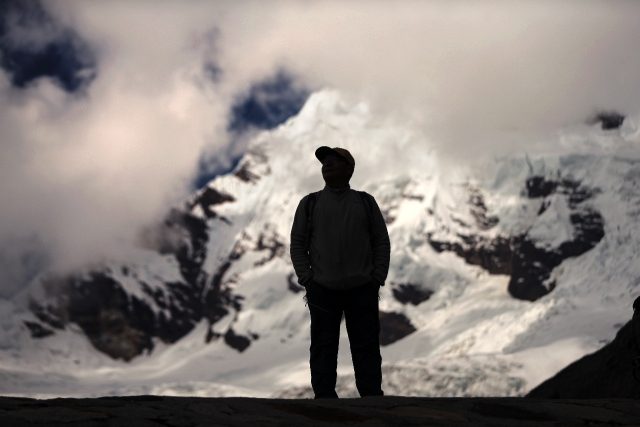 Peruvian farmer Saul Luciano Lliuya looks at the Palcaraju mountain where his Huaraz home