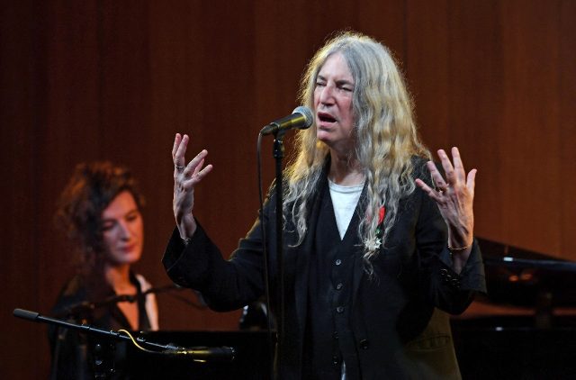 US singer-songwriter Patti Smith, accompanied on piano by her daughter Jesse Paris Smith,