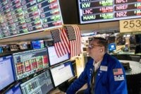 Stocks waver on Wall Street, hover close to bear market