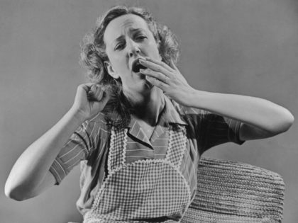 A tired housewife yawning circa 1940's. (Photo by FPG/Getty Images)