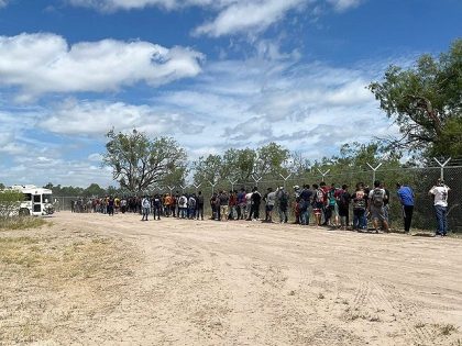 Eagle Pass Border Patrol agents apprehend a large group of migrants on June 15. (U.S. Border Patrol/Del Rio Sector)