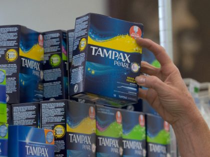 Tammy Compton restocks tampons at Compton's Market, Wednesday, June 22, 2016, in Sacramento, Calif. A bill to exempt tampons and feminine hygiene products from sales tax co-authored by Assemblywomen Cristina Garcia, D-Bell Gardens and Ling Ling Chang, R-Diamond Bar, was approved by the Senate Governance and Finance committee Wednesday. (AP …