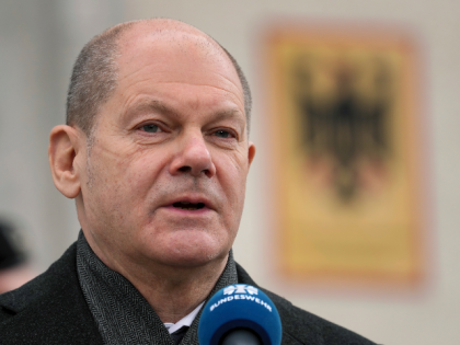 German Chancellor Olaf Scholz, right, speaks during a statement as part of a visit of the 'Joint Operations Command' of the German armed forces, Bundeswehr, in Schwielowsee near Berlin, Germany, Friday, March 4, 2022. (AP Photo/Michael Sohn)