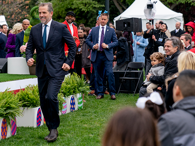 Secretary of State Antony Blinken, at right, watch as Hunter Biden, the son of President Joe Biden, left, chases after his son Beau during the White House Easter Egg Roll at the White House, Monday, April 18, 2022 in Washington. (AP Photo/Andrew Harnik)