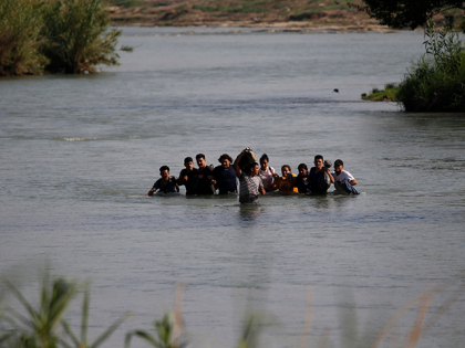 Migrants, mostly from Nicaragua, cross the Rio Grande river into the U.S., at Eagle Pass, Texas, Friday, May 20, 2022. The Eagle Pass area has become an increasingly popular crossing corridor for migrants, especially those from outside Mexico and Central America, under Title 42 authority, which expels migrants without a …