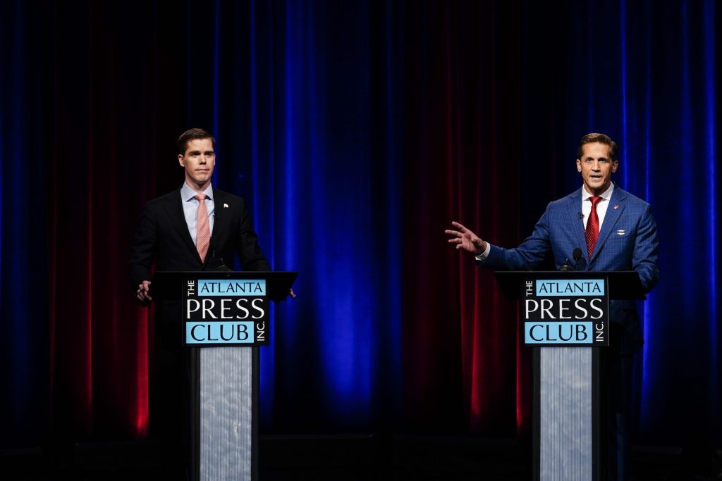 Jake Evans, left, and Rich McCormick, right, participate in Georgia's Sixth Congressional District republican primary election runoff debates on Monday, June 6, 2022, in Atlanta. (AP Photo/Brynn Anderson)