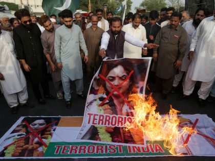 Members of a rickshaw drivers union burn a representation of an Indian national flag and pictures of Nupur Sharma, a spokesperson of the governing Hindu nationalist party, during a demonstration to condemn the derogatory references to Islam and the Prophet Muhammad made recently by Sharma, in Karachi, Pakistan, Tuesday, June …