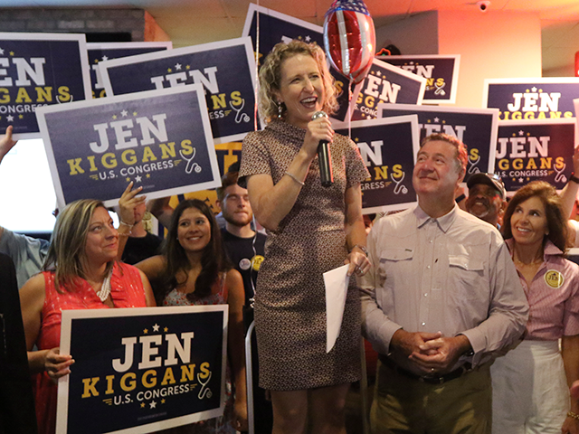 Virginia State Sen. Jen Kiggans, R-Virginia Beach, top, along with former Virginia Giov. George Allen, center right, speaks to supporters during an election party Tuesday June 21, 2022, in Virginia Beach, Va. Kiggans won a primary to face Democrat Elaine Luria in November's election. (AP Photo/Steve Helber)