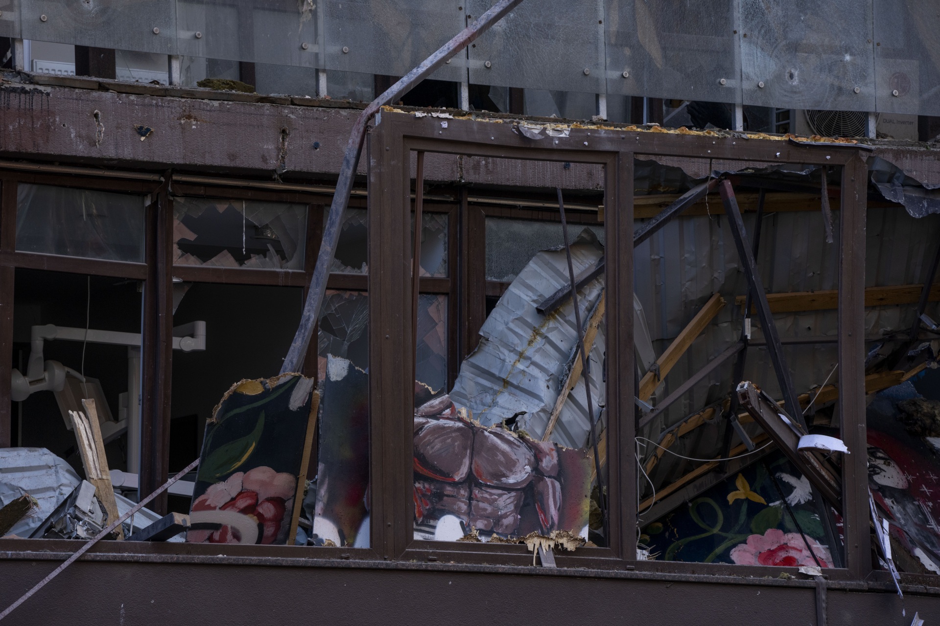 Damage of a residential building following explosions, in Kyiv, Ukraine, Sunday, June 26, 2022. Several explosions rocked the west of the Ukrainian capital in the early hours of Sunday morning, with at least two residential buildings struck, according to Kyiv mayor Vitali Klitschko. (AP Photo/Nariman El-Mofty)