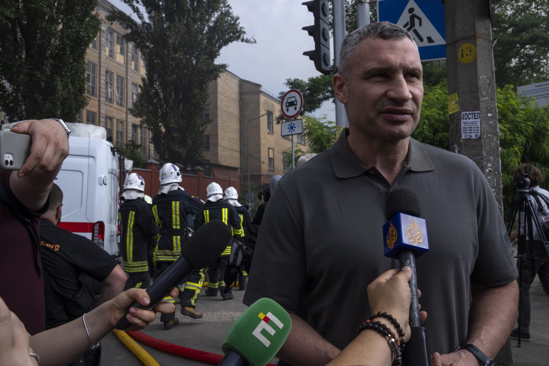 Kyiv mayor Vitali Klitschko speaks to the press at the scene of a residential building following explosions, in Kyiv, Ukraine, Sunday, June 26, 2022. Several explosions rocked the west of the Ukrainian capital in the early hours of Sunday morning, with at least two residential buildings struck, according to Klitschko. (AP Photo/Nariman El-Mofty)