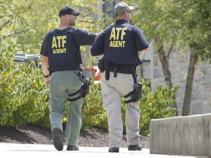 ATF officers patrol around Dietrick Hall after a lockdown of the campus was lifted at the