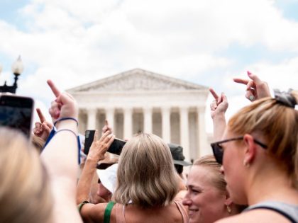 Abortion rights activists react outside the US Supreme Court in Washington, DC, on June 24, 2022. - The US Supreme Court on Friday ended the right to abortion in a seismic ruling that shreds half a century of constitutional protections on one of the most divisive and bitterly fought issues …