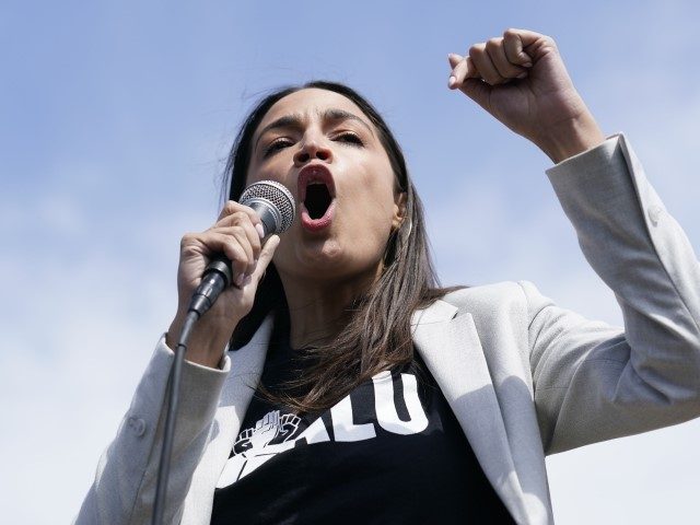 Rep. Alexandria Ocasio-Cortez (D-NY) speaks at a rally outside an Amazon facility on State