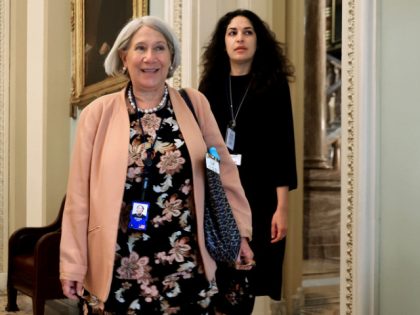 WASHINGTON, DC - JULY 22: Anita Dunn(L), senior advisor to President Joe Biden, and White House Deputy Director of Legislative Affairs Reema Dodin arrive for a lunch meeting with Senate Democrats at the U.S. Capitol on July 22, 2021 in Washington, DC. Dunn and Dodin are meeting with the senators …