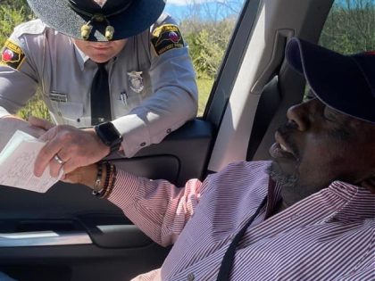 A father and a North Carolina state trooper shared a tender moment during a traffic stop in March, and a photo of the scene has touched countless people.