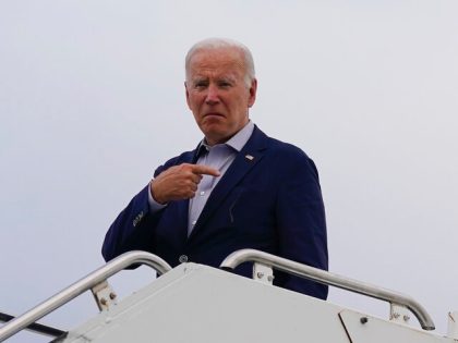 President Joe Biden motions before boarding Air Force One at Kirtland Air Force Base after meeting with state and local officials on the New Mexico wildfires, Saturday, June 11, 2022, in Albuquerque, N.M. (AP Photo/Evan Vucci)