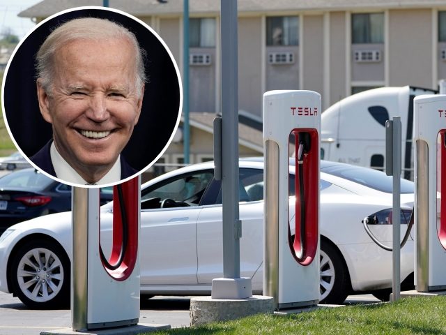 FILE - A Tesla charges at a station in Topeka, Kan., April 5, 2021. President Joe Biden and Democrats in Congress are looking to give U.S. automakers with union employees the inside track when it comes to winning the burgeoning electric vehicle market. The $1.85 trillion spending package that Democrats …
