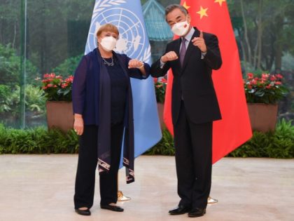 Chinese State Councilor and Foreign Minister Wang Yi meets with the United Nations High Commissioner for Human Rights, Michelle Bachelet, in Guangzhou, south China's Guangdong Province, May 23, 2022. Deng Hua/Xinhua via Getty