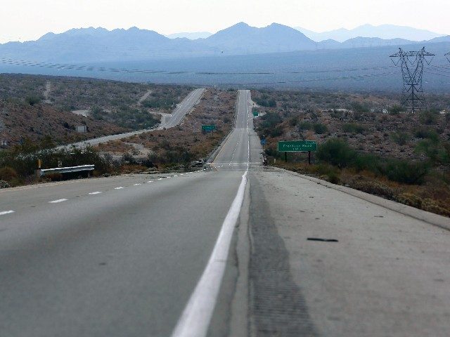 Interstate 10, facing south toward Phoenix, is empty after it was closed to traffic after