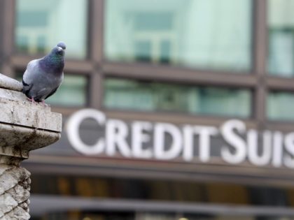 FILE- In this Tuesday, Oct. 27, 2009 file photo, a pigeon rests near a building hosting offices of Credit Suisse bank in Milan, Italy. European authorities are investigating dozens of people suspected of tax evasion involving Swiss bank Credit Suisse, officials said Friday, March 31, 2017. (AP Photo/ Antonio Calanni, …