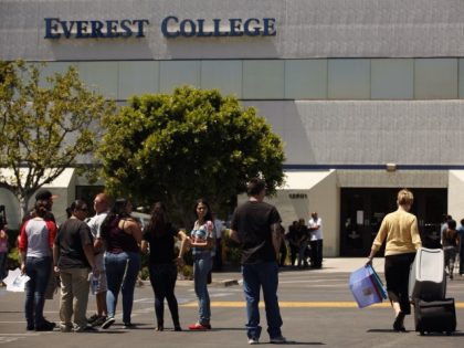 Students gather as teachers came to collect their belongings at Everest College in City of Industry, one of the Corinthian Colleges that closed on Monday, April 27, 2015.