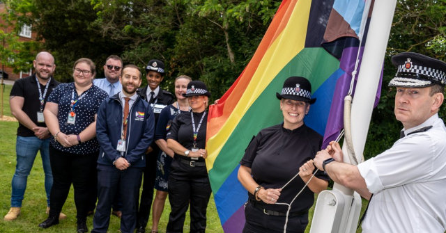 UK police pose with an advancing pride flag and promise to ‘monitor’ responses to hate speech