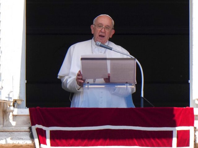 Pope Francis delivers his speech as he recites the Regina Coeli noon prayer from the windo