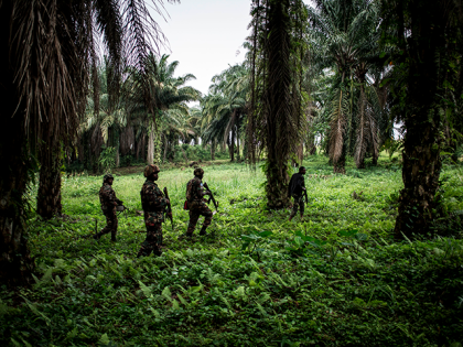 A picture taken on November 13, 2018, shows Tanzanian soldiers from the United Nations Organization Stabilization Mission in the Democratic Republic of the Congo (MONUSCO) patroling against Ugandan Allied Democratic Force (ADF) rebels in Beni. - The Beni area has for the last four years been under seige from the …