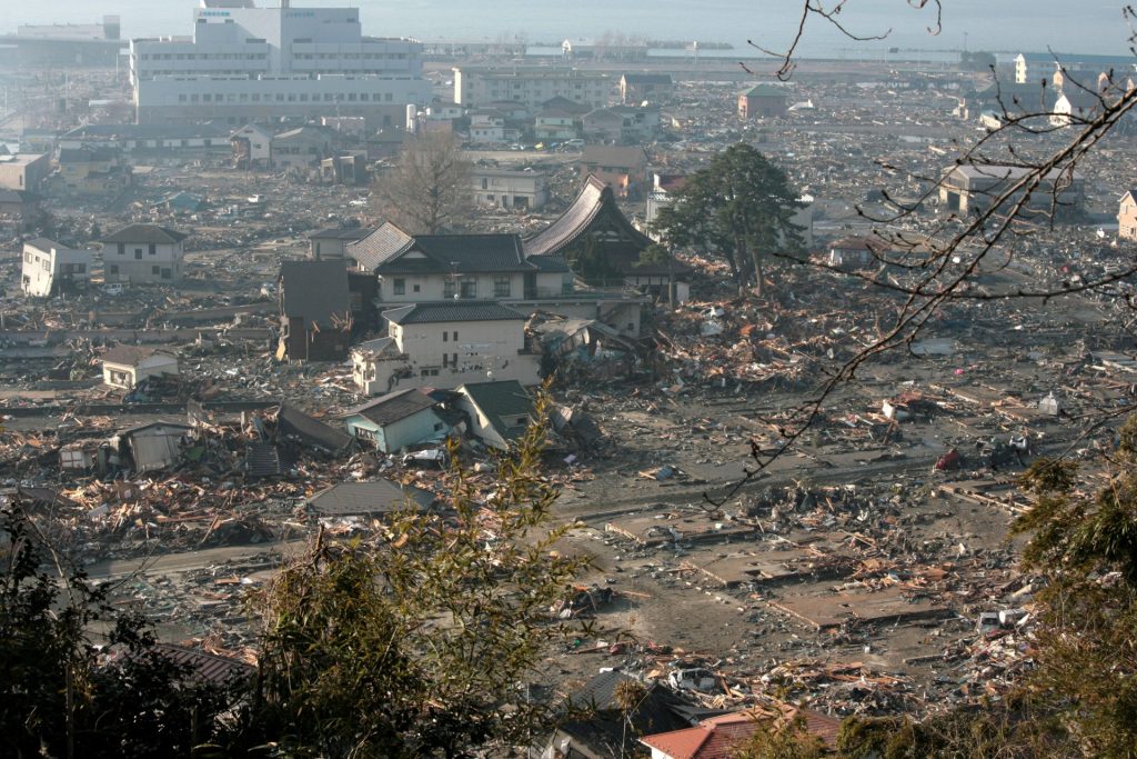 In this handout images provided by the International Federation of Red Cross Japan, A general view is seen of what is left of the city after a tsunami wiped away the gas station which caused a fire and burnt down the whole town, after an 9.0 magnitude strong earthquake struck on March 11, off the coast of north-eastern Japan, March 14, 2011 in Otsuchi, Japan. The quake struck offshore at 2:46pm local time, triggering a tsunami wave of up to 10 metres which engulfed large parts of north-eastern Japan. On Tuesday there was a third explosion from the Fukushima Daiichi nuclear power plant causing fears for the radiation levels being emitted from the plant. Japan have implemented a no fly zone for 30km round the reactors in order to stop any further spread of radiation. (Photo by Toshiharu Kato/Japanese Red Cross/IFRC via Getty Images)