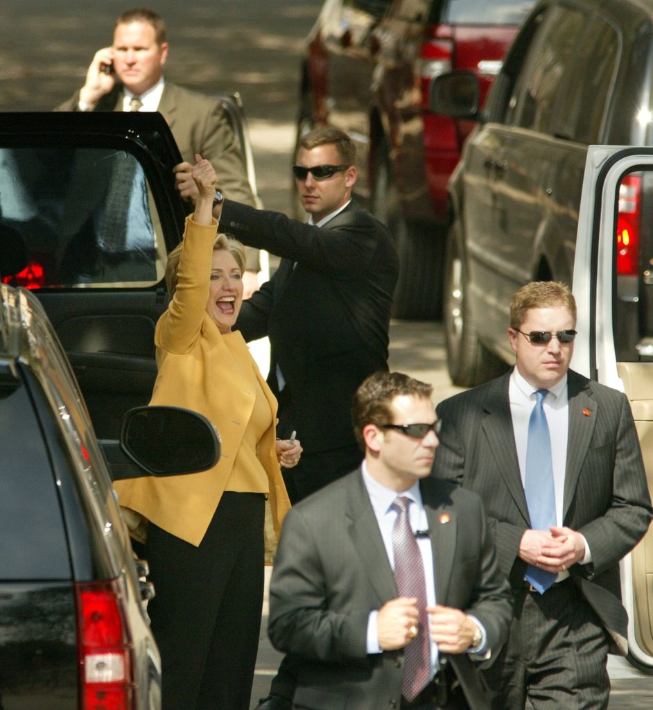 Surrounded by her Secret Service security detail, Democratic presidential candidate Sen. Hillary Clinton has one last thumbs-up for the crowd before she leaves the the Fort Worth Stockyards in Fort Worth Texas, Saturday, March 1, 2008. (Photo by Paul Moseley/Fort Worth Star-Telegram/Tribune News Service via Getty Images)
