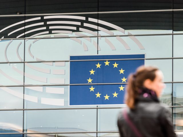 The stars of the European Union (EU) sit on the glass facade of the European Parliament's