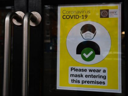 A sign reading 'Please Wear A Mask' seen at the entrance to a business premises in Dublin during Level 5 Covid-19 lockdown. On Friday, February 5, 2021, in Dublin, Ireland. (Photo by Artur Widak/NurPhoto via Getty Images)