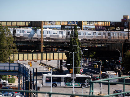 A J train runs on an elevated track in the 75th precinct in the East New York neighborhood in the Brooklyn borough of New York, U.S., on Sunday, Sept. 19, 2021. In fiscal 2020, New York City police officers logged more overtime hours than any other big city in the …