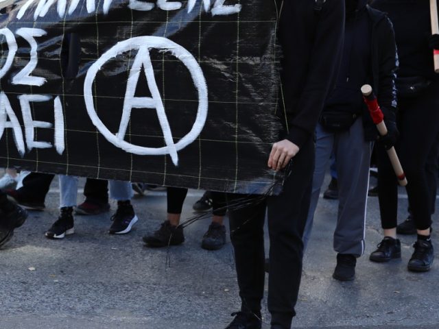 ATHENS, GREECE - DECEMBER 6: People take part in a march during the death anniversary of G