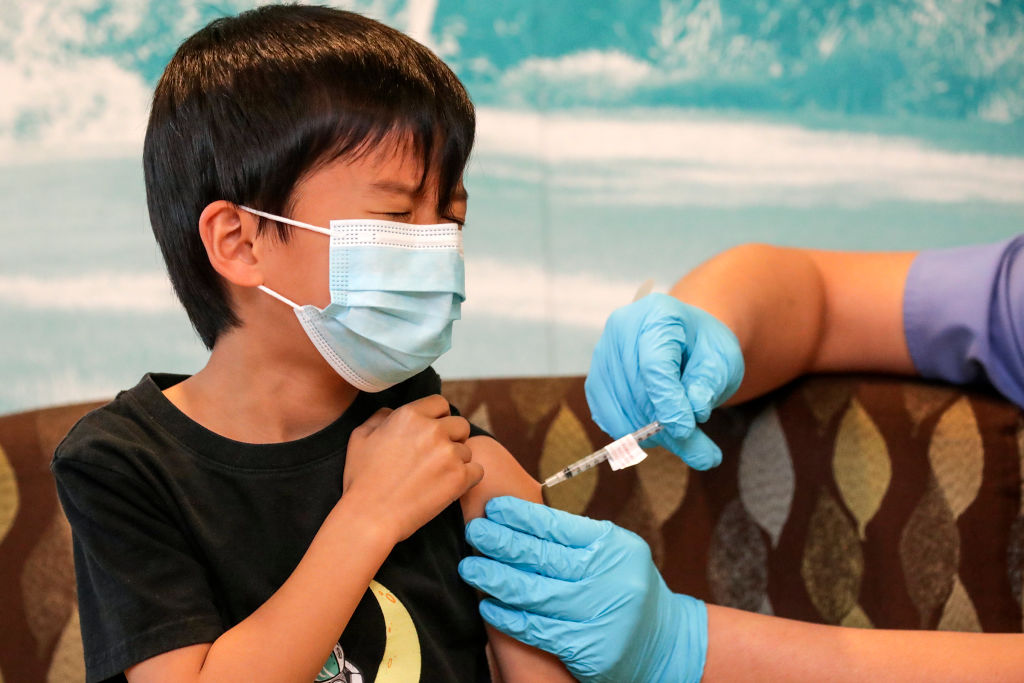 Arcadia, CA - January 08: Alden Lee, 6, gets first dose of Pfizer-BioNtech Covid-19 vaccine at Children's Hospital Arcadia Speciality Care Center on Saturday, Jan. 8, 2022 in Arcadia, CA. (Irfan Khan / Los Angeles Times via Getty Images)