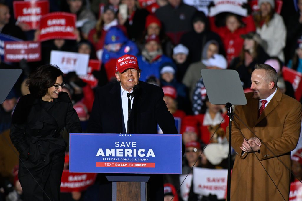 FLORENCE, USA - MARCH 12: Former US President Donald Trump (C), flanked by Republican House of Representative candidates Katie Arrington (L) and candidate Russell Fry (R), addresses the crowd during a rally sponsored by Save America with Governor Henry McMaster in Florence, SC, United States on March, 12, 2022. (Photo by Peter Zay/Anadolu Agency via Getty Images)