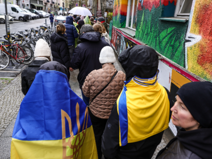 BERLIN, GERMANY - APRIL 10: Visitors and refugees from Ukraine queue in the street to enter the "Beacon of Ukraine" gathering at Markthalle Neun on April 10, 2022 in Berlin, Germany. The gathering is bringing together refugees and NGOs as well as presenting Ukrainian culture. Tens of thousands of refugees …