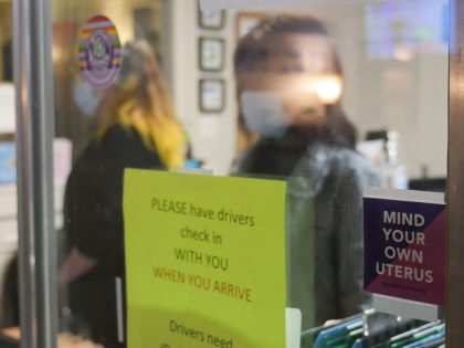 A sign reading "Mind Your Own Uterus" is taped on the check-in window at the Hope Medical Group for Women in Shreveport, Louisiana, April 19, 2022. - On September 1, 2021, one of the most restrictive anti-abortion laws in the country went into effect in the Republican state of Texas, …