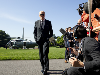 President Joe Biden finishes speaking to members of the media after arriving on Marine One