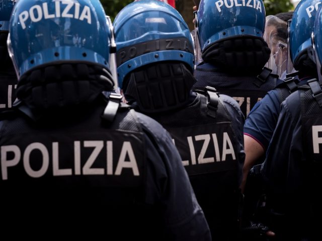 ROME, ITALY - MAY 30: Police in riot gear block the protest of the Movements for the right to housing against the Conference on Rome's Public Heritage in front Centrale Montemartini on May 30, 2022 in Rome, Italy. The conference is to take stock of social housing to meet the …